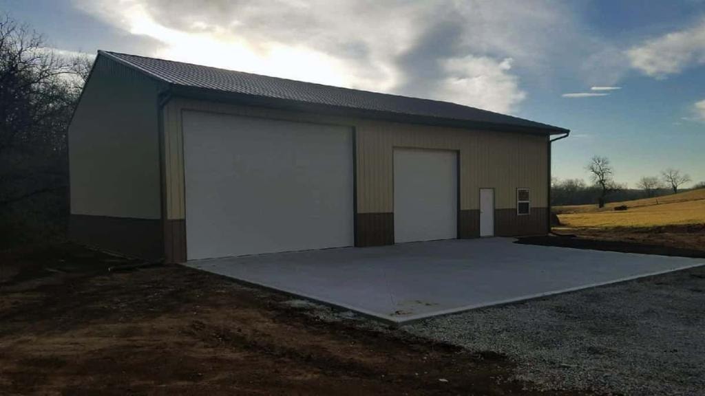 Completed post frame pole barn with metal siding